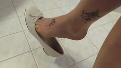 Andres Machado soft white ballet flats and nylons, dangling by Isabelle-Sandrine Thumb