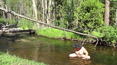 Bathing naked in the creek. Thumb